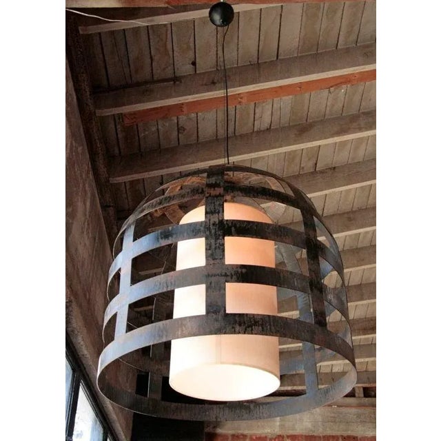 Cage iron chandelier by Ma+39. It will take 2-3 weeks to make this piece