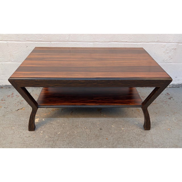 Striking vintage Mid-Century Modern coffee table crafted from stunning Macassar ebony. Renowned for its dramatic dark...
