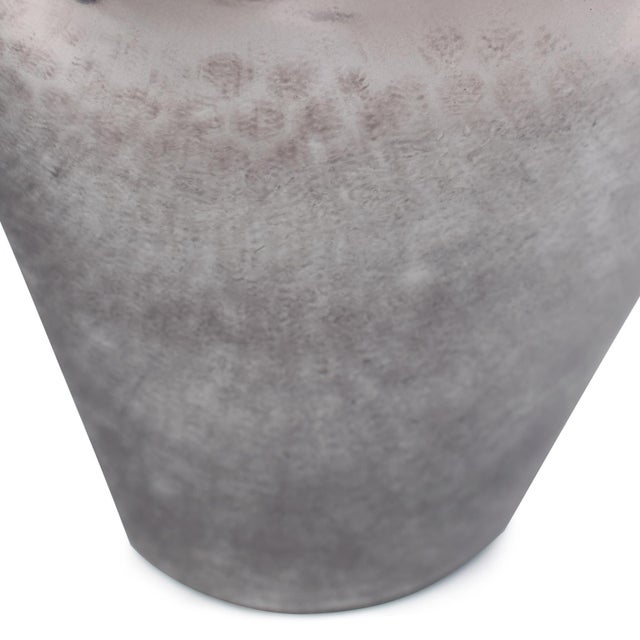 A true masterpiece adorned with black and silver details that seamlessly blend in a captivating gradient. The lid,...