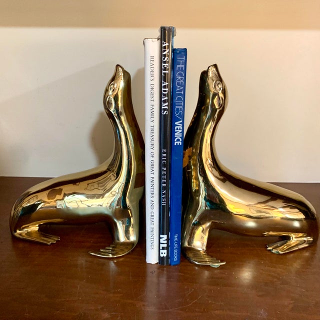 Large Pair of Brass Bookends or Figurines by Sarreid, Ltd. Each Sea Lion is 11" tall, 9" in length, 8" wide and weighs...