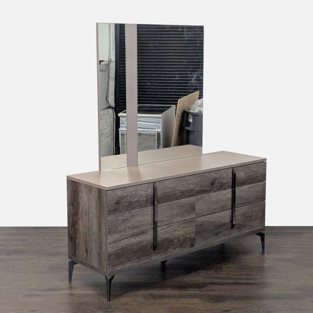 Upgrade your bedroom with this ALF Italia dresser. It features six spacious drawers for easy storage and a large mirror...
