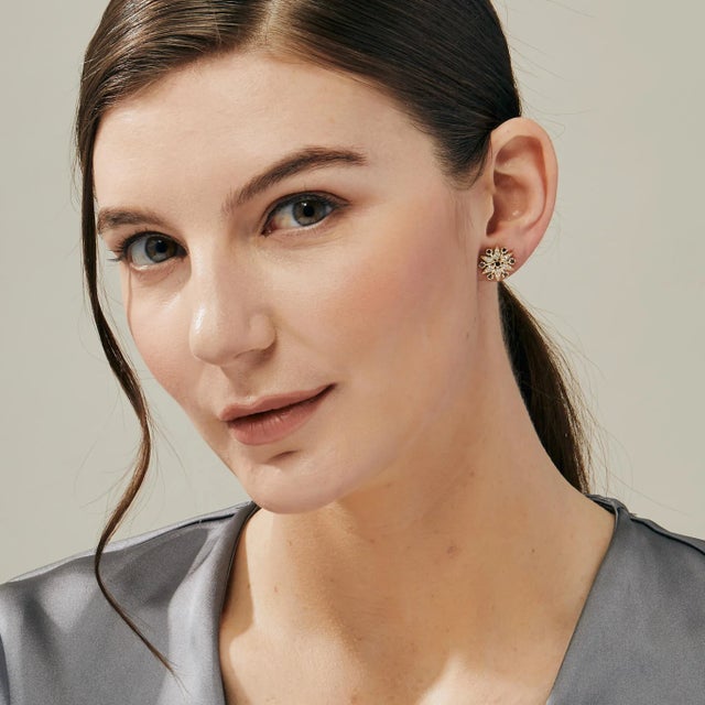 Created in 18 karat yellow gold Blue sapphires 0.35 carat approx. Diamonds 0.50 carat approx. 18kyg butterfly backs...