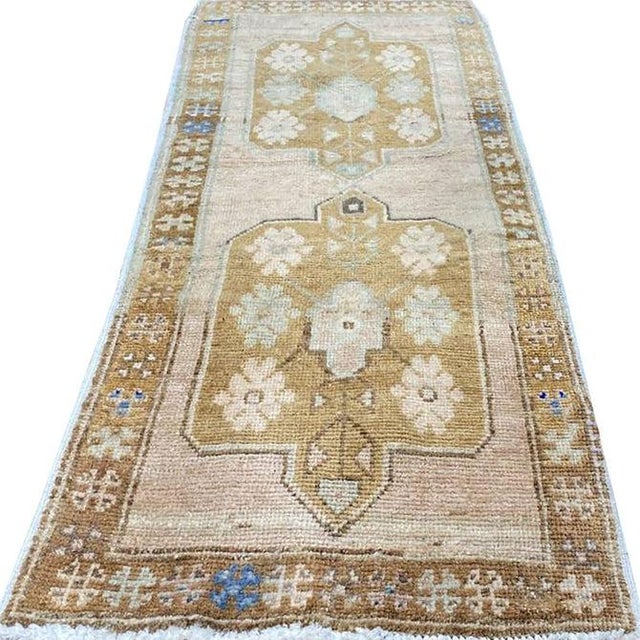 Exact Size: 1'6" x 3'6" Color: Brown Age: Old Materials: Wool Construction: Hand Knotted Origin: Turkey