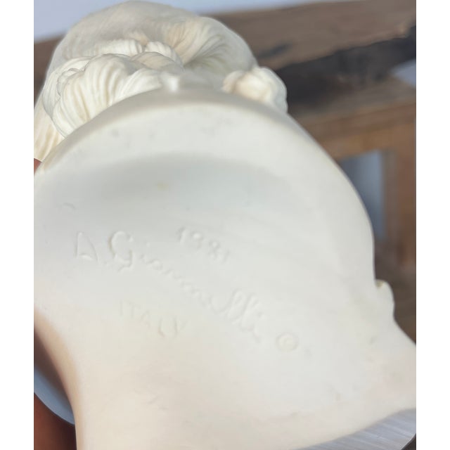 This bust is a sculpture of a young lady by the noted Italian artist Arnoldo Giannelli. It is often referred to by names...