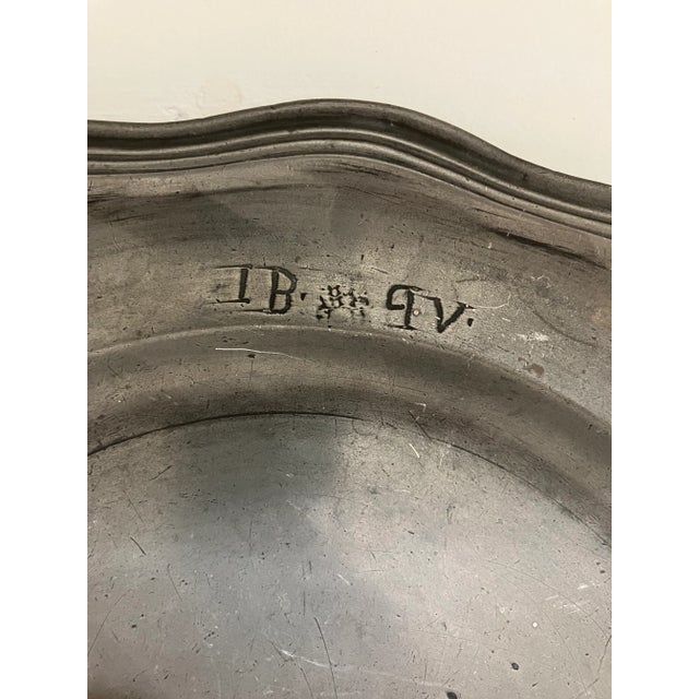 Lovely old English Pewter Platter. Scalloped edge. Deep bowl. Markings at the top of tray "I B 9 V" No makers mark on...