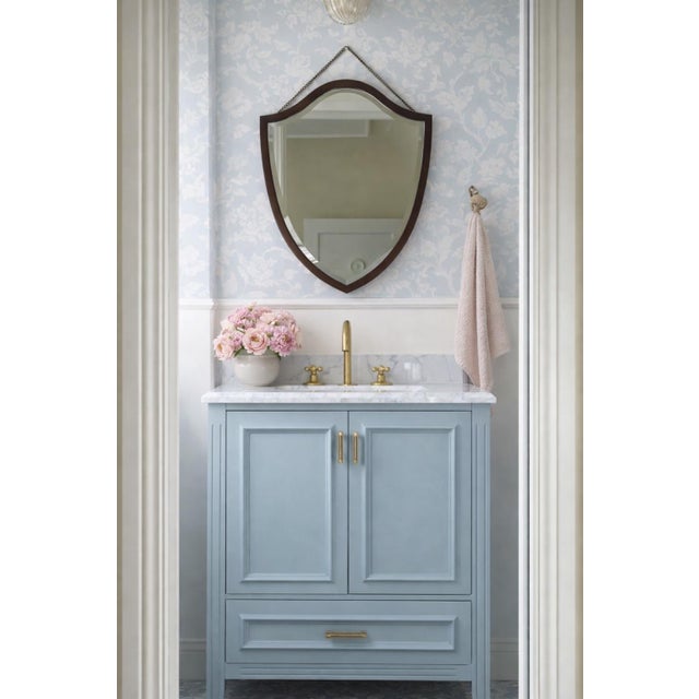 A refined and timeless Bombay Company shield‑form mirror, featuring a rich dark Cherry or Mahogany frame and a crisp...