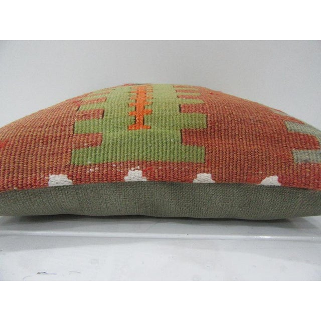 This is a pillow cover made from a vintage kilim rug. The piece was properly washed and ready to use. Pillow inserts not...