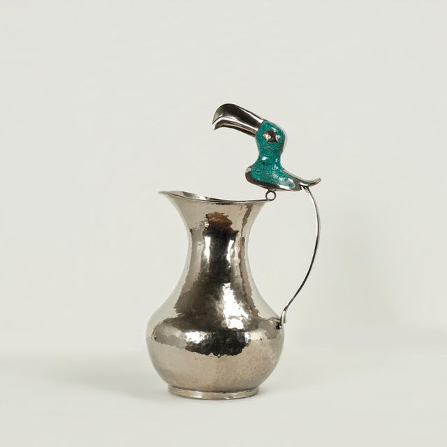 Charming whimsical mid century pitcher handcrafted in silver plate on hammered copper in modern form,in the style of...