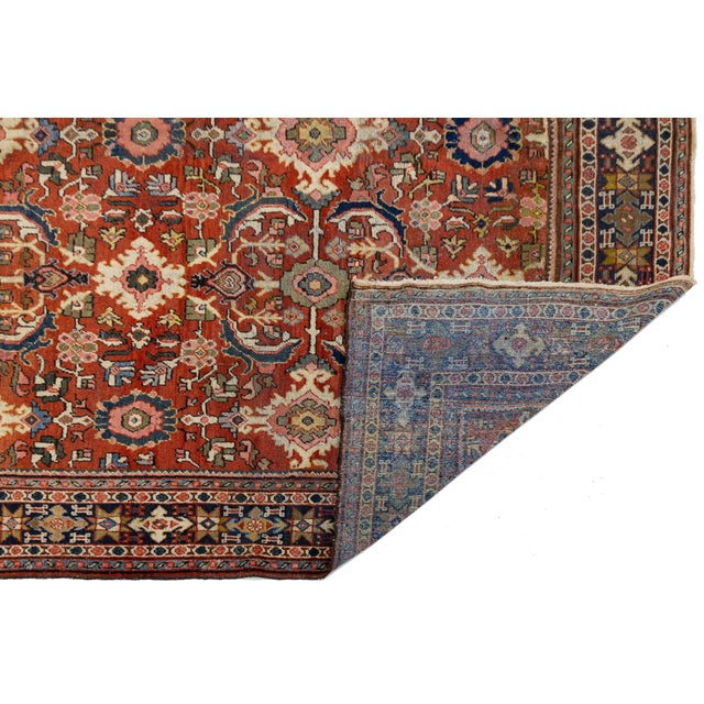 Experience the timeless elegance of central Persia with this authentic hand-knotted Vintage Mahal rug. Crafted from high-...
