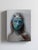In "Cascade," a figure emerges with an ethereal quality, their features softened by fluid brushwork and a cool color...