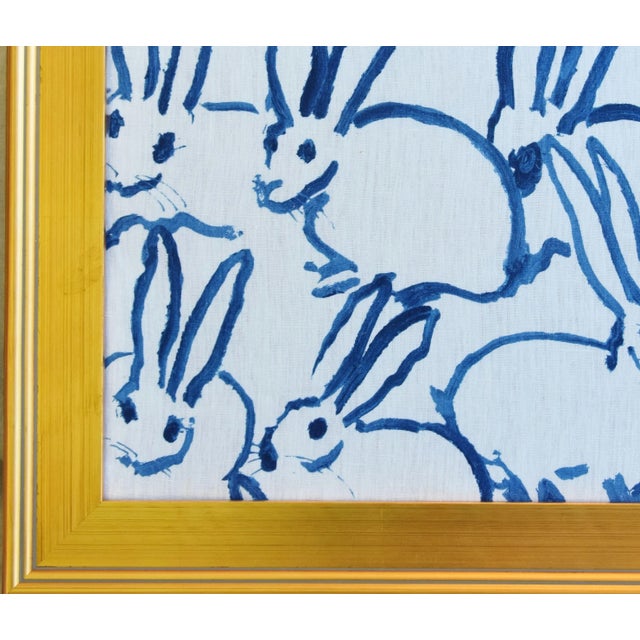 Custom framed Hunt Slonem's blue and white bunny hutch linen fabric textile. Displayed under non-glare Plexiglass....