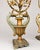 A highly decorative near pair of Italian polychrome and parcel-gilt torchère candelabra, conceived in a theatrical...