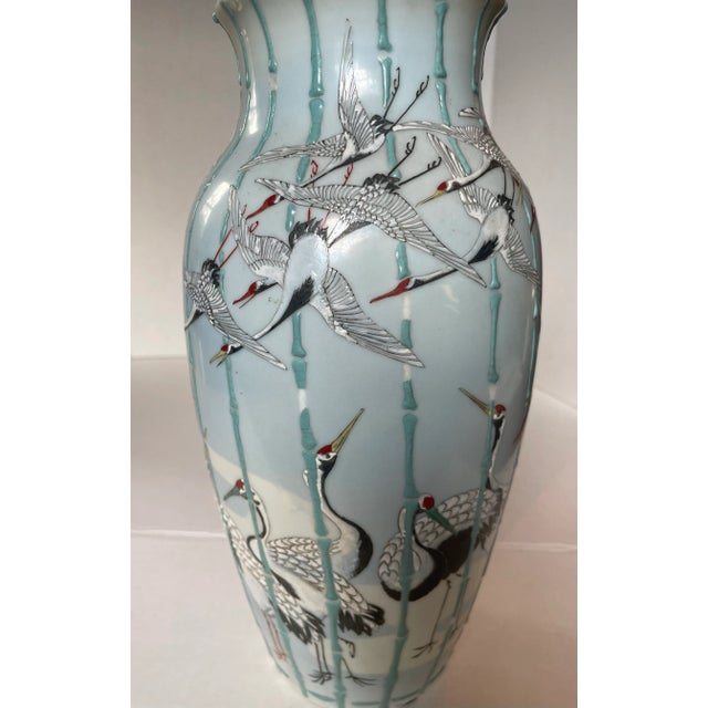 Japanese Meiji Period flying crane vase, early 20th C. (1900-1920s). Pale blue glaze porcelain with over glaze enamel...