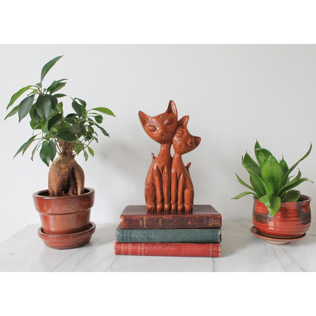 Mid-century carved wood Siamese cats sculpture. No makers mark. Some chips on ears. Pictured.