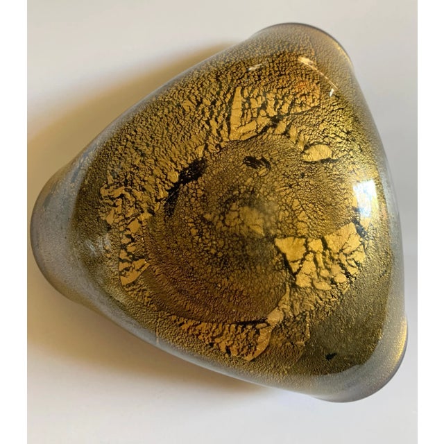 A hand blown glass bowl with White interior and heavy gold fleck details on exterior of glass - a wonderful decorative...