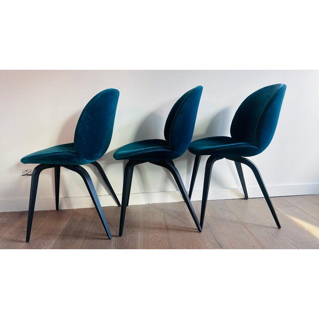 Set of 6 Attributed Gubi Teal Velvet chairs with Black oak legs. In GREAT condition. One minor smudge on velvet seat of...