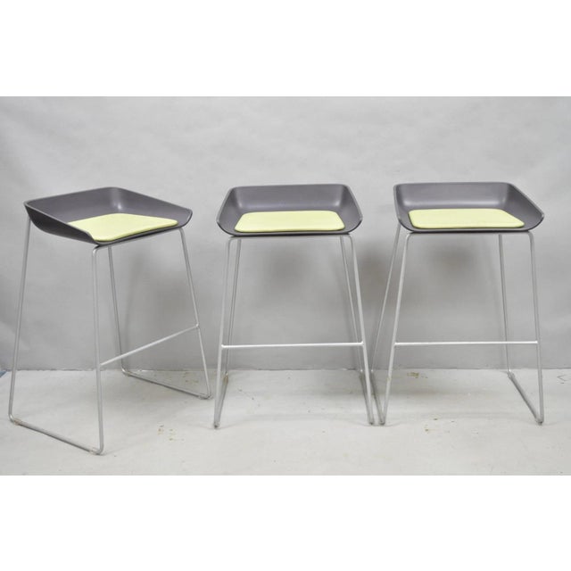 Turnstone by Steelcase Modernist Metal Scoop Barstool Stools w/ Green Cushions - Set of 3. Circa 21st Century....