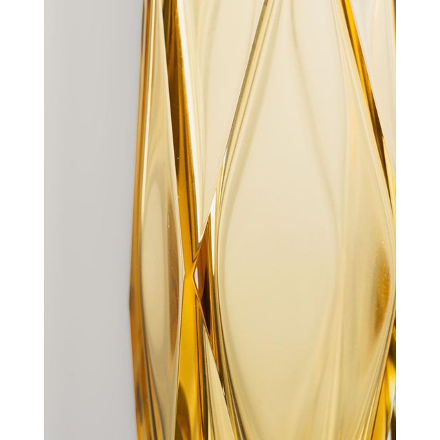 Faceted Murano glass vase in amber. It combines amber and clear glass with an eight-sided geometric facet that resembles a...