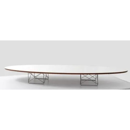 An iconic white Elliptical Table Rod Base (ETR) is commonly called the "Surfboard" coffee table. It it is attributed to...