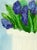 A contemporary still life with a playful shift in focus, Blue Hyacinth Flowers No. 1 centers on a large, ivory-toned...