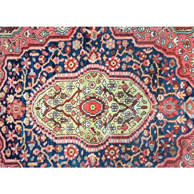 A beautiful and rare early 20th century Persian Sarouk Farahan rug with a large central medallion with myriad flowers and...