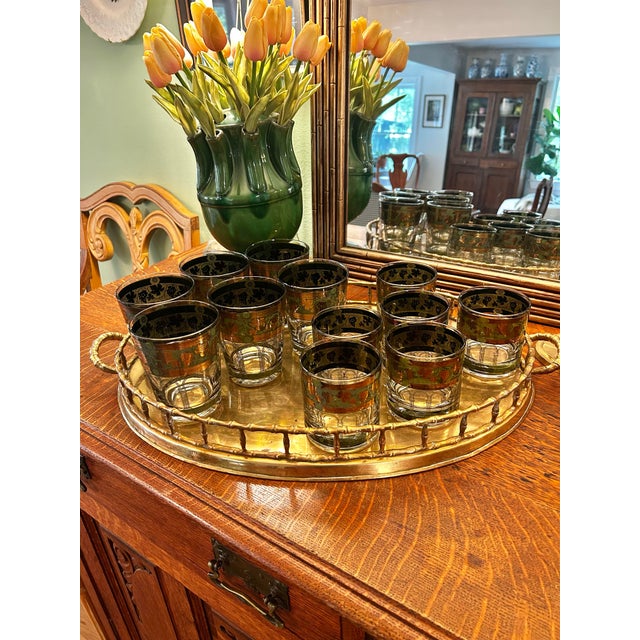 Cera barware was made popular in the Mid Century with its gold detail and colorful patterns. “Golden Grapes Green” is...