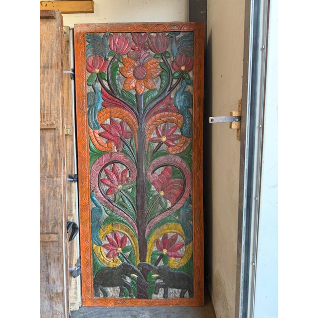 Bring timeless craftsmanship and global character into your home with this vintage hand-carved Indian wood panel,...