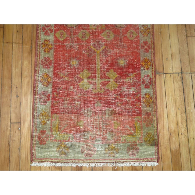 a late 19th century one-of-a-kind worn Antique Khotan runner. 2'5'' x 9'