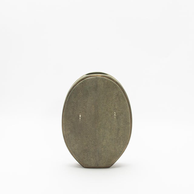 The elegant Oval Vase by R&Y Augousti, crafted in shagreen and accented with brass, is a sophisticated fusion of organic...