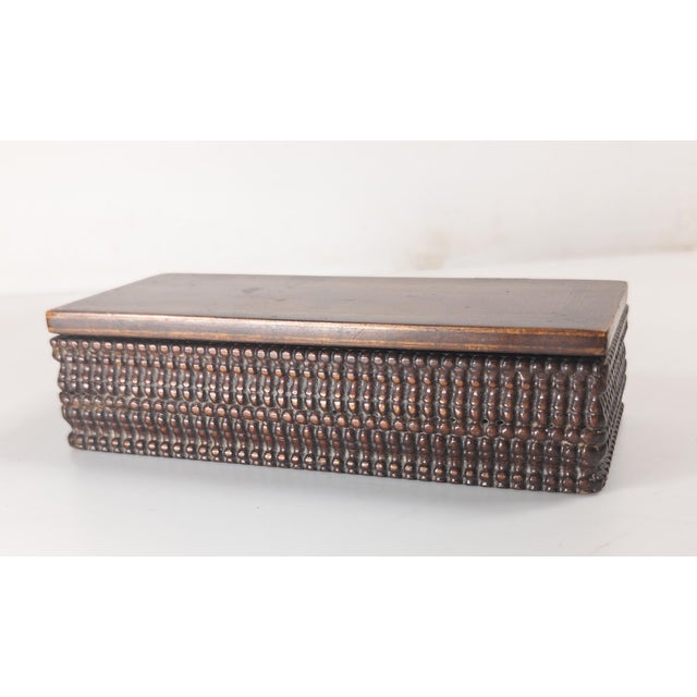 We are selling this really interesting little wood box. This folk art or tramp art box has great sides which are carved...