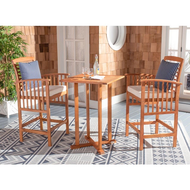 The hottest rooftop bars in Palm Springs inspired this 3 piece bistro set. Crafted in a warm natural finish, its...