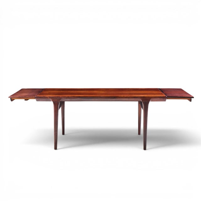 Niels Moller Mid Century Danish Rosewood Hidden Leaf Expanding Dining Table with 2 Leaves This table measures: 68 wide x...