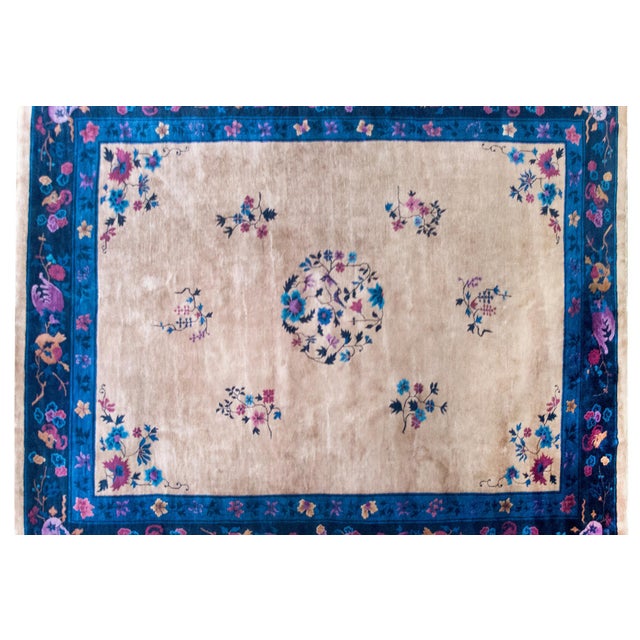 A lush and lyrical composition, this early 20th-century Chinese Art Deco rug brings together bold color, cultural...