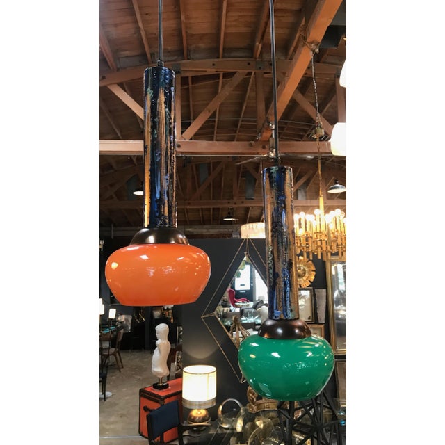 Pair of Esperia pendants cold painted in orange and green, Italy, 1970s.