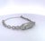 This exquisite Art Deco-style diamond bracelet is crafted in gleaming white platinum and set entirely with brilliant-cut...