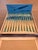 Great piece of history in its original box! Set of 12 tiny forks made of stainless steel and plastic. The ivory colored...