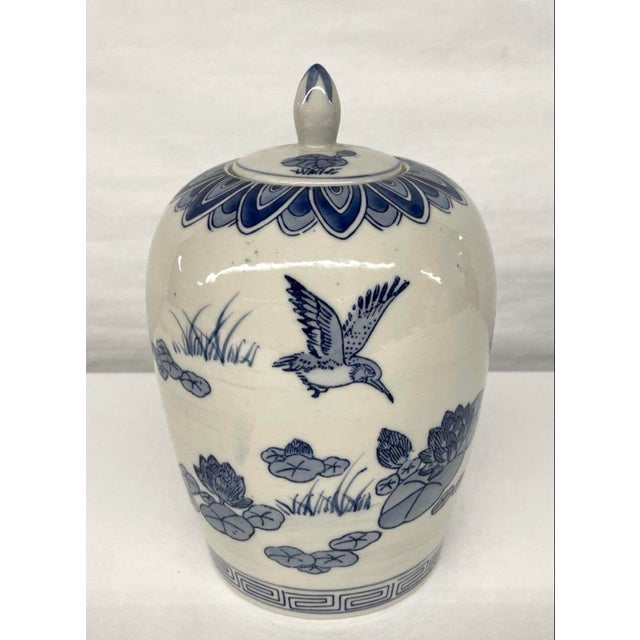 Late 20th Century Chinese Ginger Jar / Urn. Beautifully hand painted in the perfect shade of dark blue against a linen...