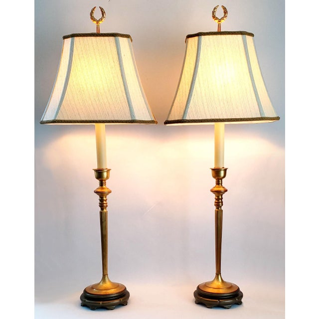 Offering a luxurious pair of RESTORED candlestick table lamps with pale yellow silk vintage shades, circa 1960s. These...