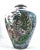 Large and unusual vase hand painted with huge leaves and flowers. Sitting quite small among the giant foliage is a very...