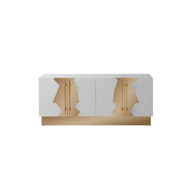 The Callista Sideboard features an Art deco-inspired design on the doors with a solid wood body and stainless-steel...