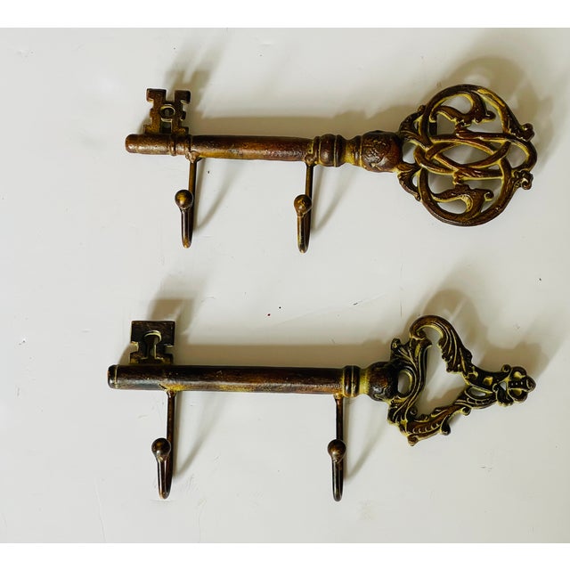 Nice ornate pair of heavy brass wall key hangers.