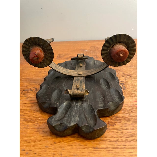 Vintage wall sconce, mixed metal with two candles on thick 1” hand carved wood mounting. Centrally located below rests a...