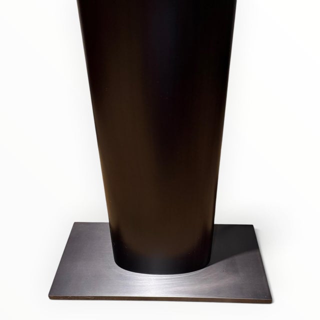 Modern floor lamp by design legend Christian Liaigre (French, 1943-2020). The Merlot lamp is a striking piece with an...