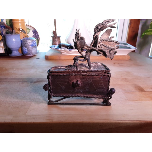 The kuduo is a hand made cast (lost wax method) bronze vessel used by the elite caste of the Akan ( ethnic group of Ghana)...