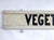 Vintage two sided hand lettered black and white Vegetables farm stand sign. Sign has original hooks for hanging....