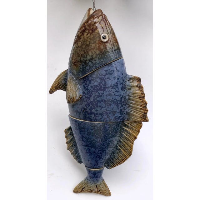 Hanging in your kitchen or out in your garden this ceramic fish will give that country farmhouse feel. Fashioned in four...