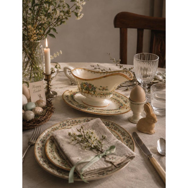 An exquisite Royal Worcester gravy boat and matching oval underplate in the beautiful "Riviera" pattern — bearing the...