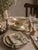 An exquisite Royal Worcester gravy boat and matching oval underplate in the beautiful "Riviera" pattern — bearing the...