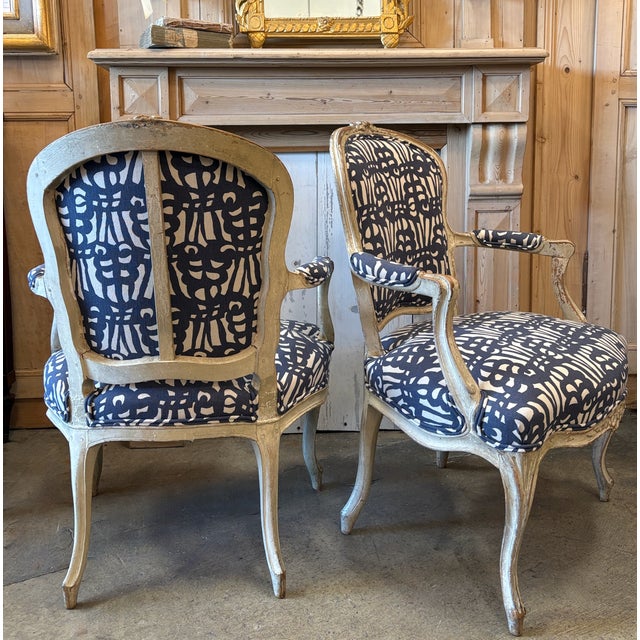Great pair of Louis XVI style Early 19th century Bergere chairs. This is a his and her's set with each chair varying in...