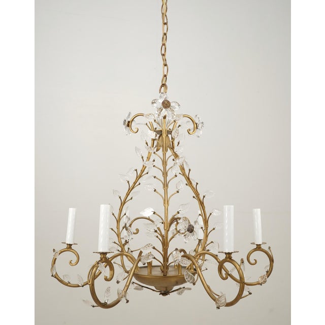 Bagues style chandelier with Louis XV influence in a gold finish wrought iron frame and glass foliate motifs. The flowers...